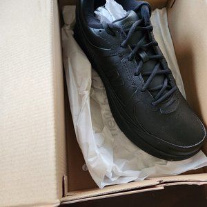 Black leather New Balance sneakers